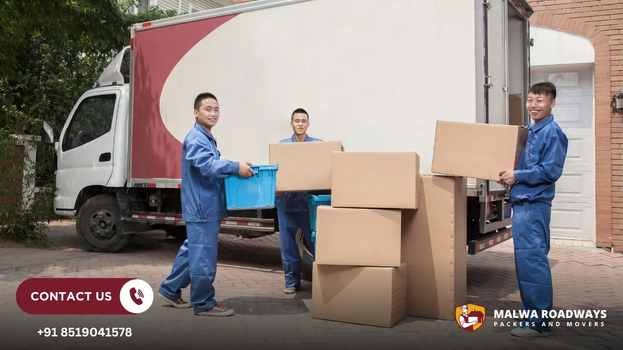 Movers Holding Moving Boxes
